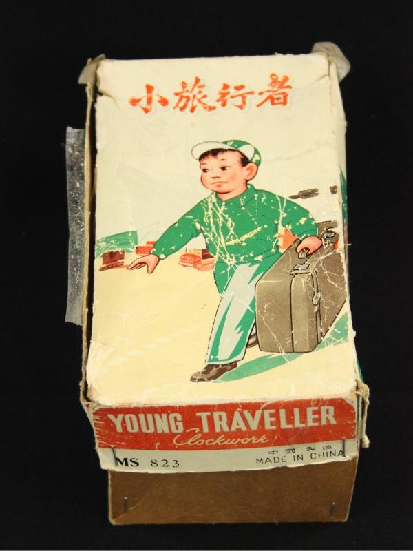 Vintage, rubberen opwindfiguur met tinnen valies - in O.V.P.