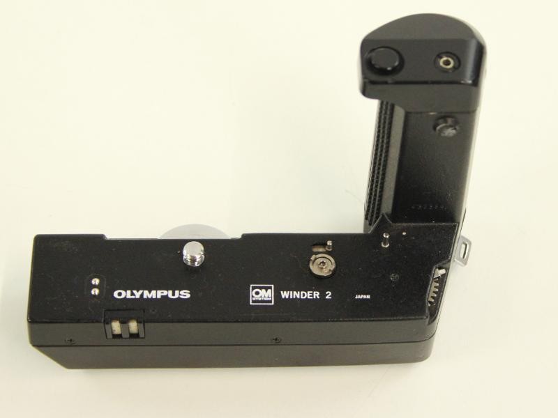 Vintage Olympus OM-2 spiegelreflexcamera met extra lenzen in draagtas