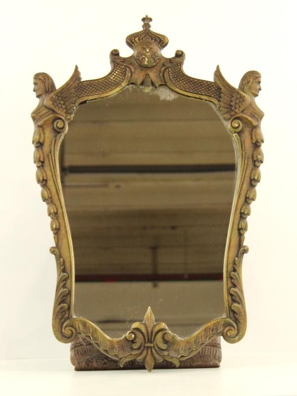 Knappe, oude spiegel met veel decoratie (fleurs de lis)