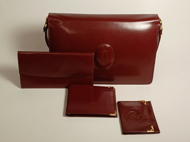 Vintage bordeaux Cartier schoudertas met portefeuille, chequehouder en visitekaarthouder