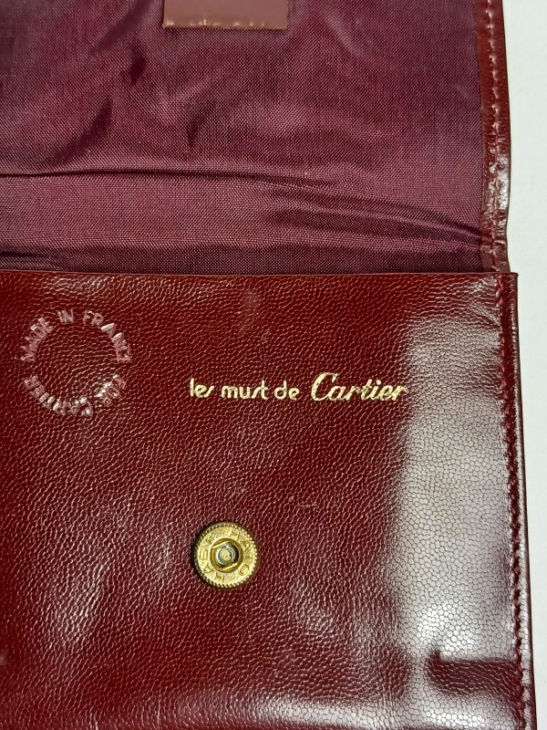 Vintage bordeaux Cartier schoudertas met portefeuille, chequehouder en visitekaarthouder